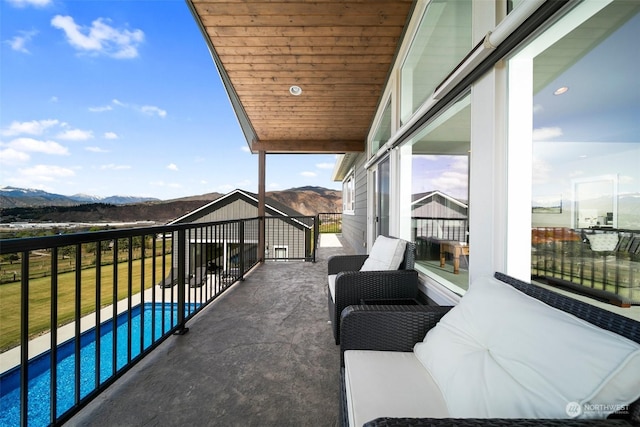 balcony featuring a mountain view