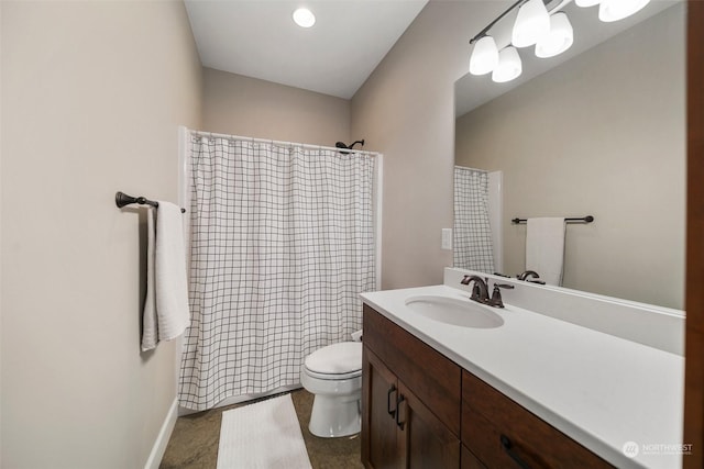 bathroom with vanity, a shower with shower curtain, and toilet