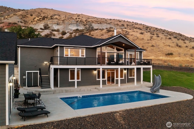11 Holcomb Dr, East Wenatchee, WA 98802 - back of house featuring a lawn, a patio, stairs, and a deck with mountain view