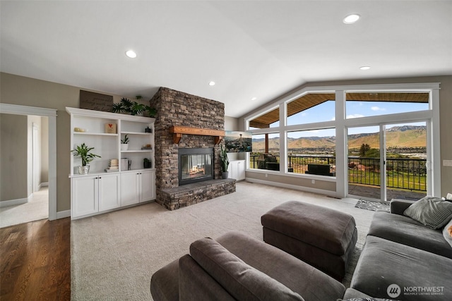 11 Holcomb Dr, East Wenatchee, WA 98802 - living room with a stone fireplace, lofted ceiling, recessed lighting, light wood-style flooring, and baseboards