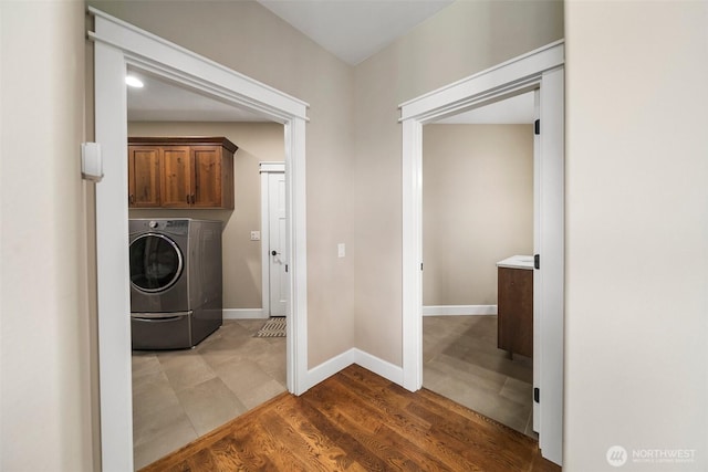 11 Holcomb Dr, East Wenatchee, WA 98802 - washroom featuring washer / clothes dryer, cabinet space, baseboards, and wood finished floors