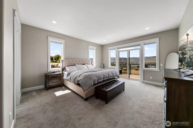 11 Holcomb Dr, East Wenatchee, WA 98802 - carpeted bedroom with access to exterior, multiple windows, baseboards, and recessed lighting