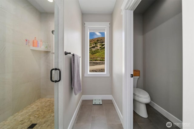 11 Holcomb Dr, East Wenatchee, WA 98802 - full bath with a shower stall, toilet, baseboards, and tile patterned floors