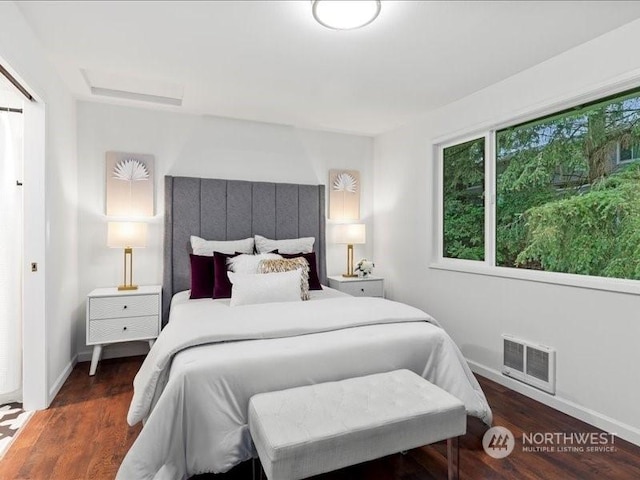 bedroom with dark wood-type flooring