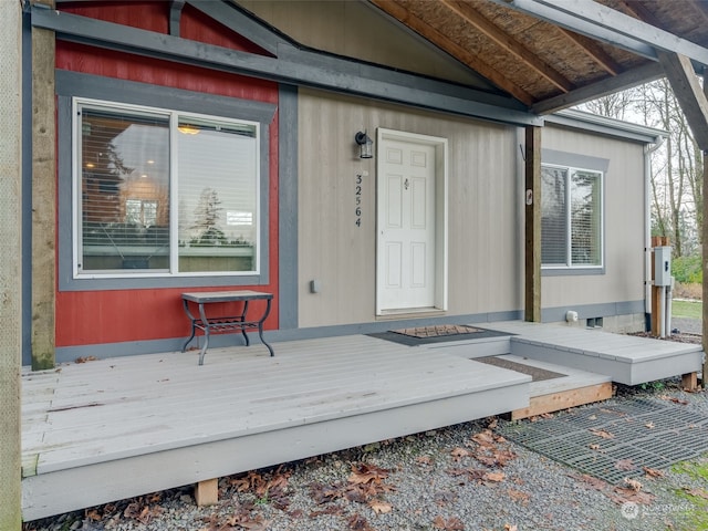 doorway to property with a wooden deck