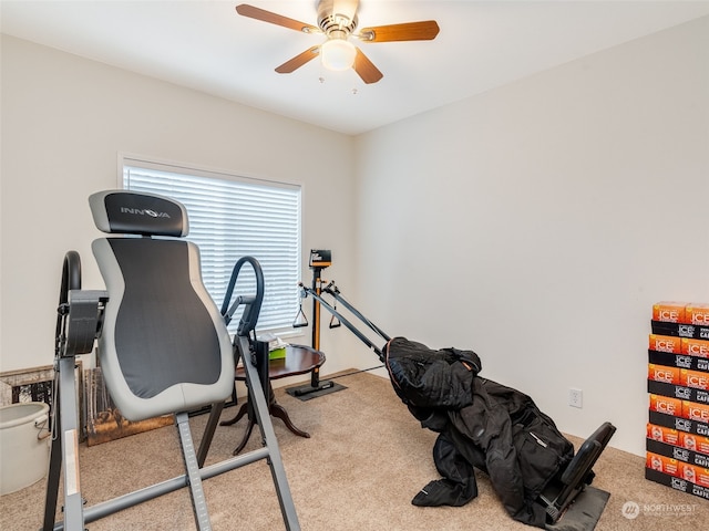 workout area with light carpet and ceiling fan