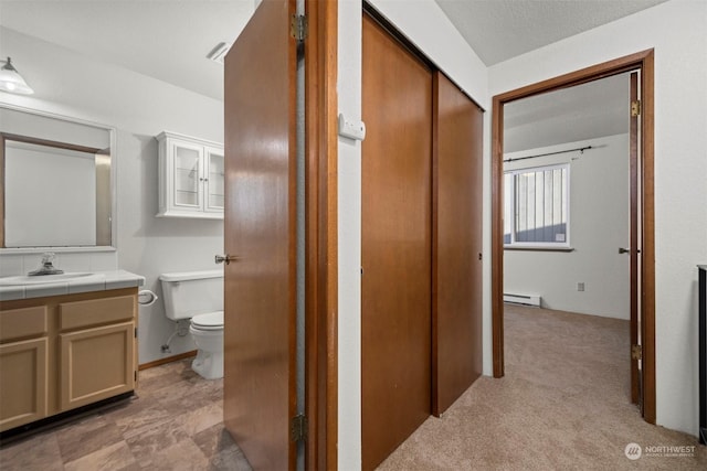 1305 W Clearbrook Unit 7, Bellingham, WA 98229 - hall featuring a sink and a baseboard heating unit