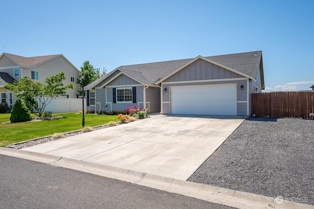 view of front facade with a front yard and a garage