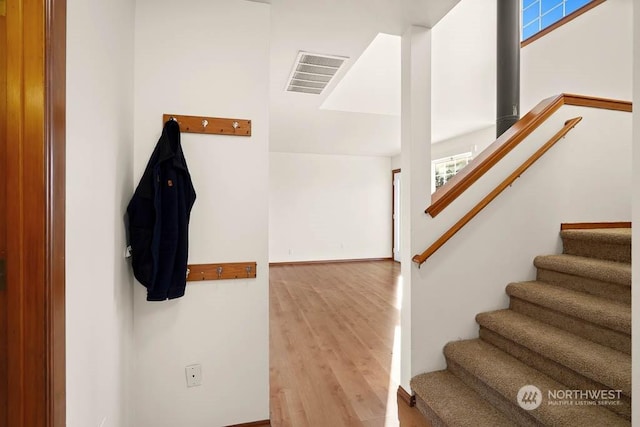 stairway with wood-type flooring