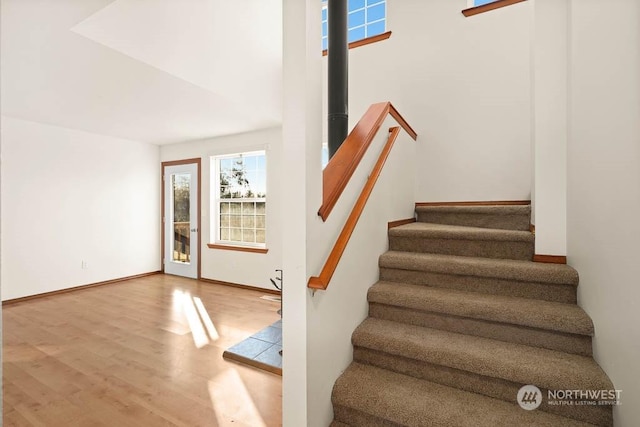 stairs with hardwood / wood-style floors