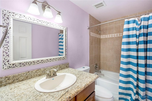 full bathroom featuring vanity, toilet, and shower / bath combo with shower curtain