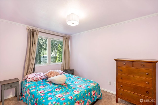 carpeted bedroom featuring crown molding