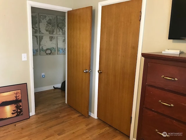 hallway featuring light hardwood / wood-style flooring