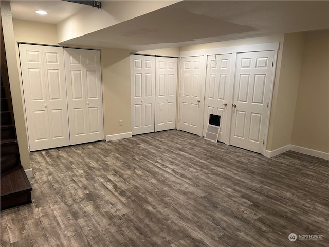 basement featuring dark hardwood / wood-style flooring