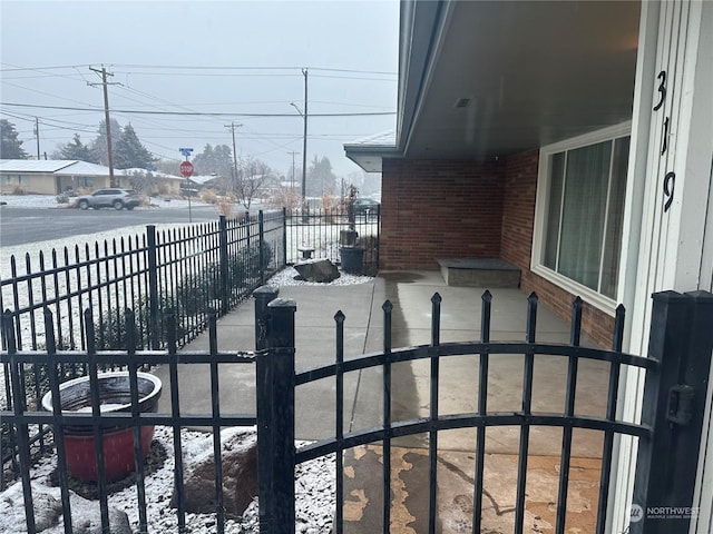 view of snow covered patio