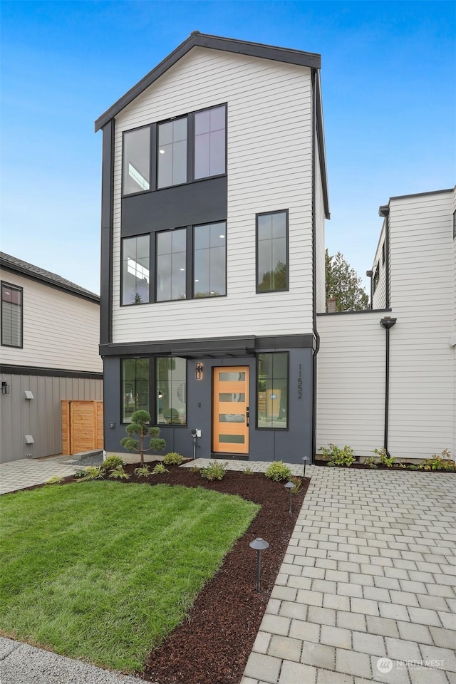 contemporary house with a front lawn