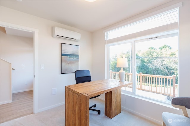 home office featuring light carpet, a wall mounted air conditioner, and a wealth of natural light