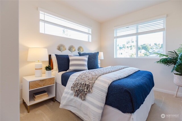 bedroom featuring light carpet