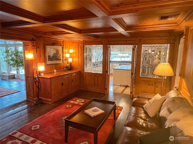 interior space featuring ornamental molding, coffered ceiling, wooden walls, hardwood / wood-style flooring, and beamed ceiling