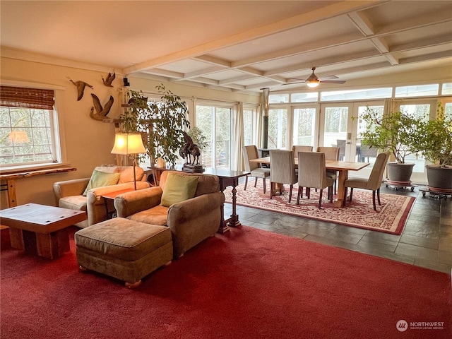 7251 Oak Bay Rd, Port Ludlow, WA 98365 - living room with coffered ceiling, ceiling fan, beam ceiling, stone tile flooring, and french doors