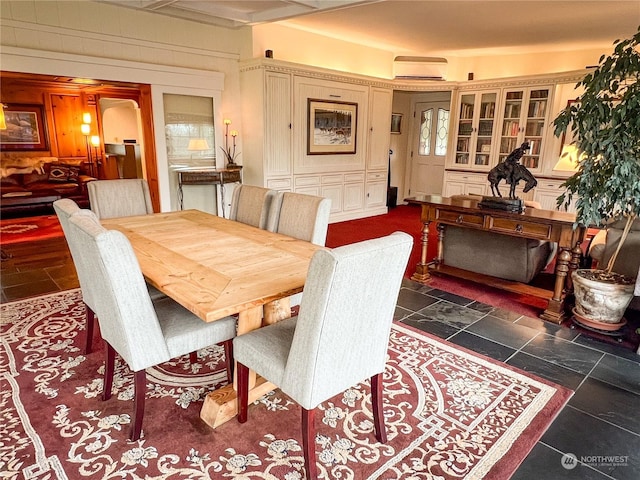 dining space featuring a wall mounted air conditioner