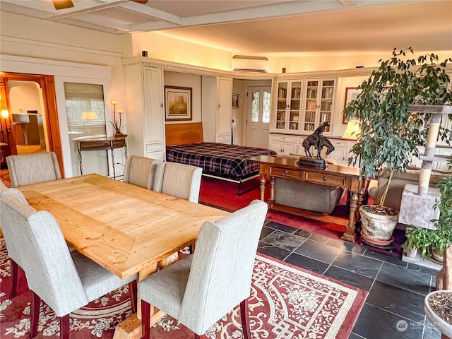 7251 Oak Bay Rd, Port Ludlow, WA 98365 - dining area featuring an AC wall unit and stone finish floors