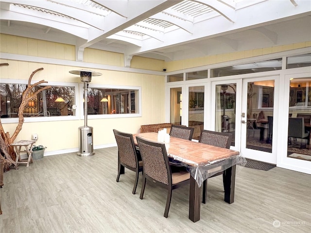 sunroom featuring french doors