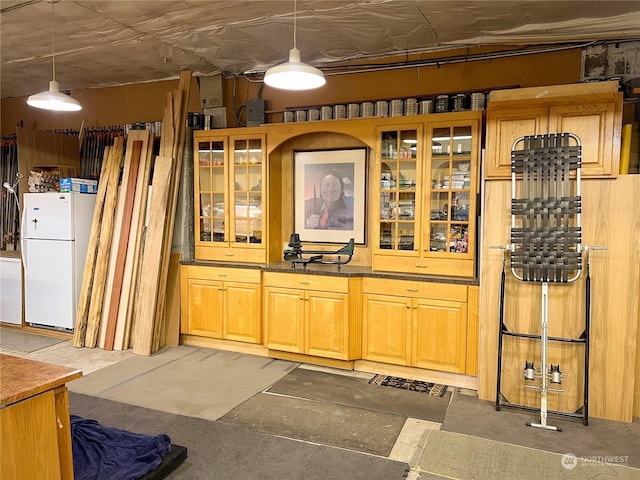 7251 Oak Bay Rd, Port Ludlow, WA 98365 - interior space featuring freestanding refrigerator and decorative light fixtures