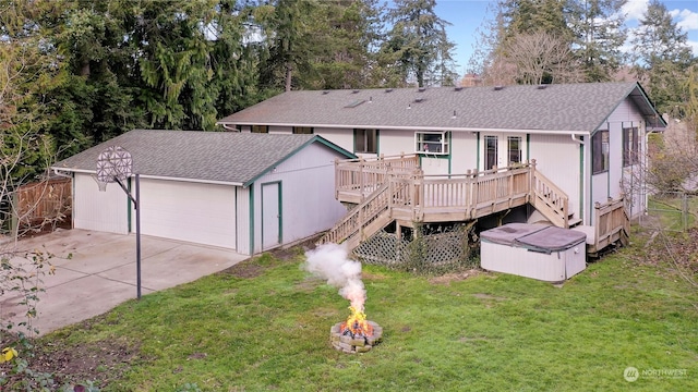 rear view of property with a lawn and a wooden deck