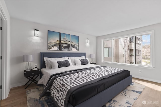 bedroom with wood-type flooring