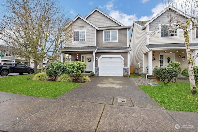 view of front of property with a front yard and a garage