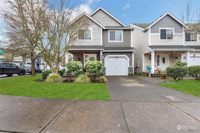 view of front of house with a garage and a front yard