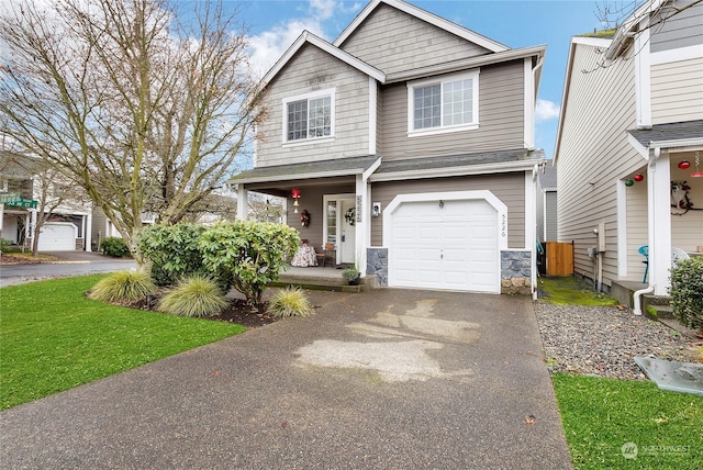 view of front of property featuring covered porch and a garage