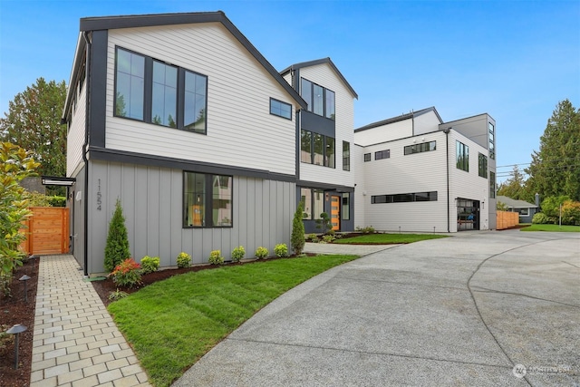 contemporary house with a front lawn