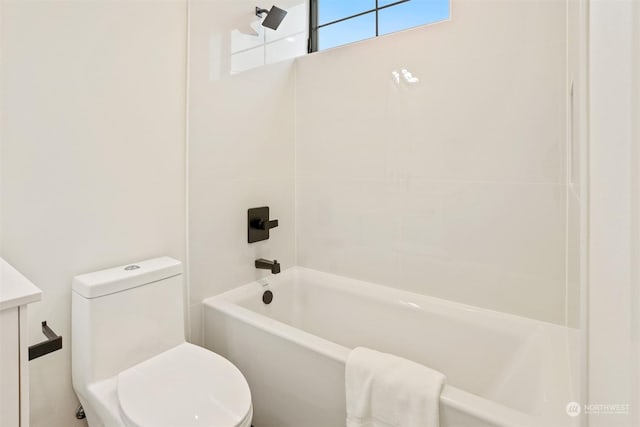 full bathroom featuring vanity, toilet, and tiled shower / bath