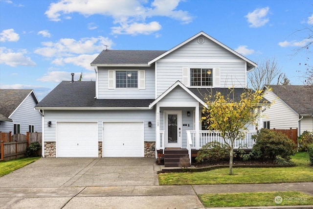 view of front facade with a front yard and a garage