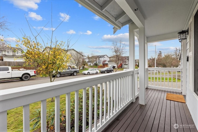 wooden deck featuring covered porch