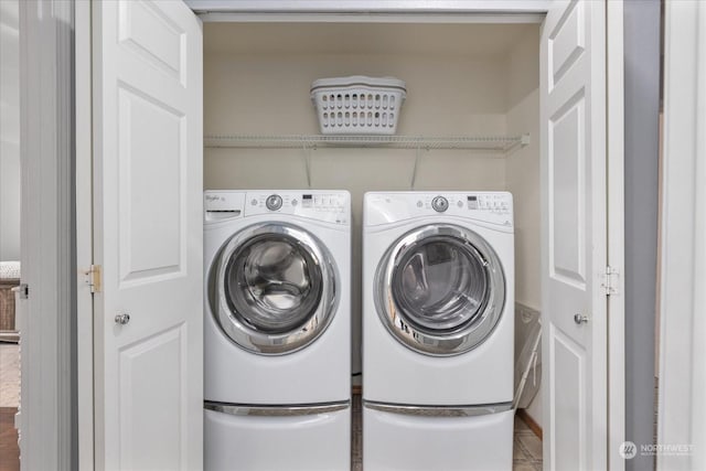 laundry area with washer and clothes dryer