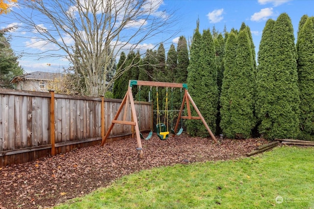 view of playground with a lawn