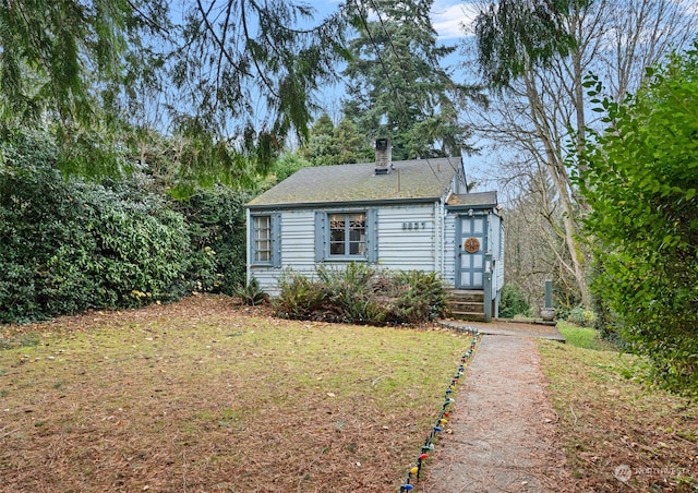 view of front of home with a front yard