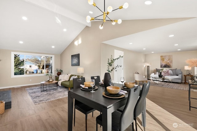 dining room with light wood-type flooring, an inviting chandelier, and lofted ceiling