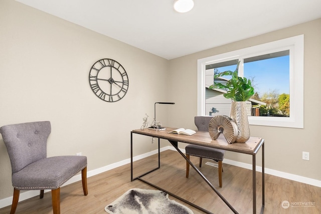 home office with light wood-type flooring