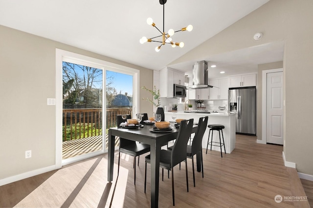 dining area featuring a chandelier, high vaulted ceiling, dark wood-type flooring, and sink