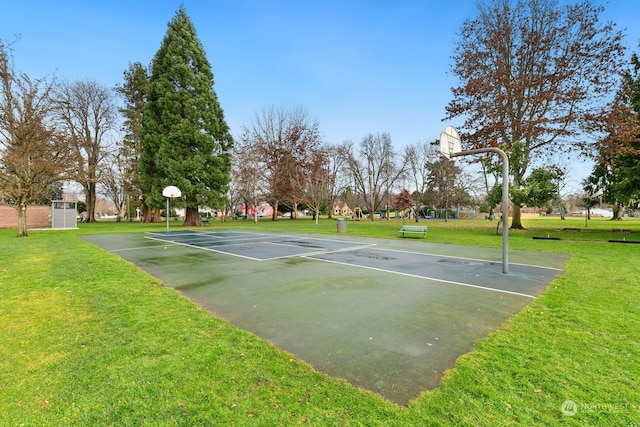 view of sport court featuring a yard