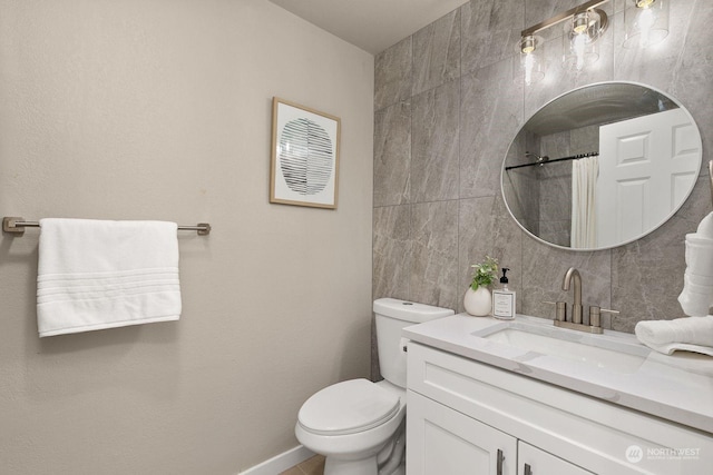 bathroom featuring a shower with curtain, vanity, toilet, and tile walls