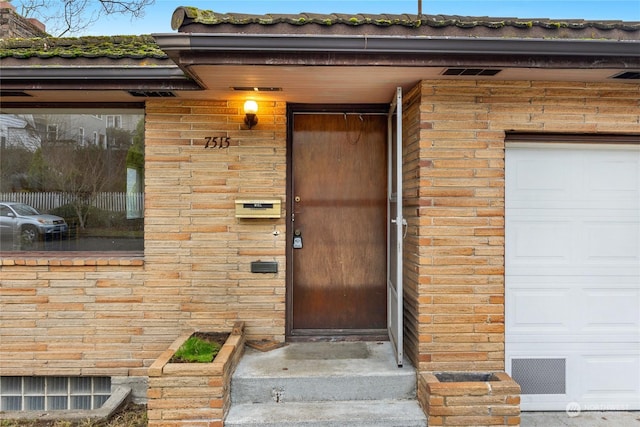 property entrance featuring a garage