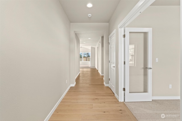 hallway with light wood-type flooring