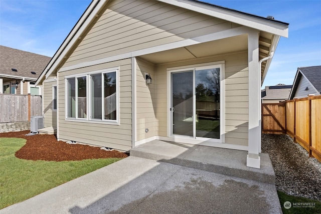 rear view of property featuring cooling unit and a patio