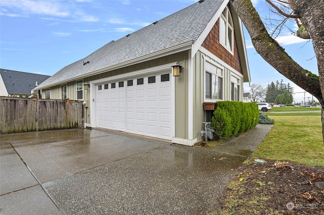 view of side of home featuring a garage