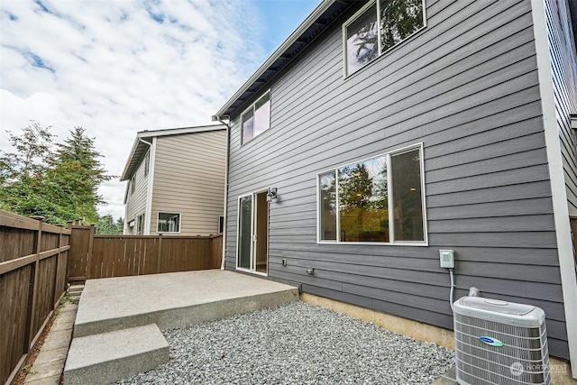 view of home's exterior featuring central air condition unit and a patio